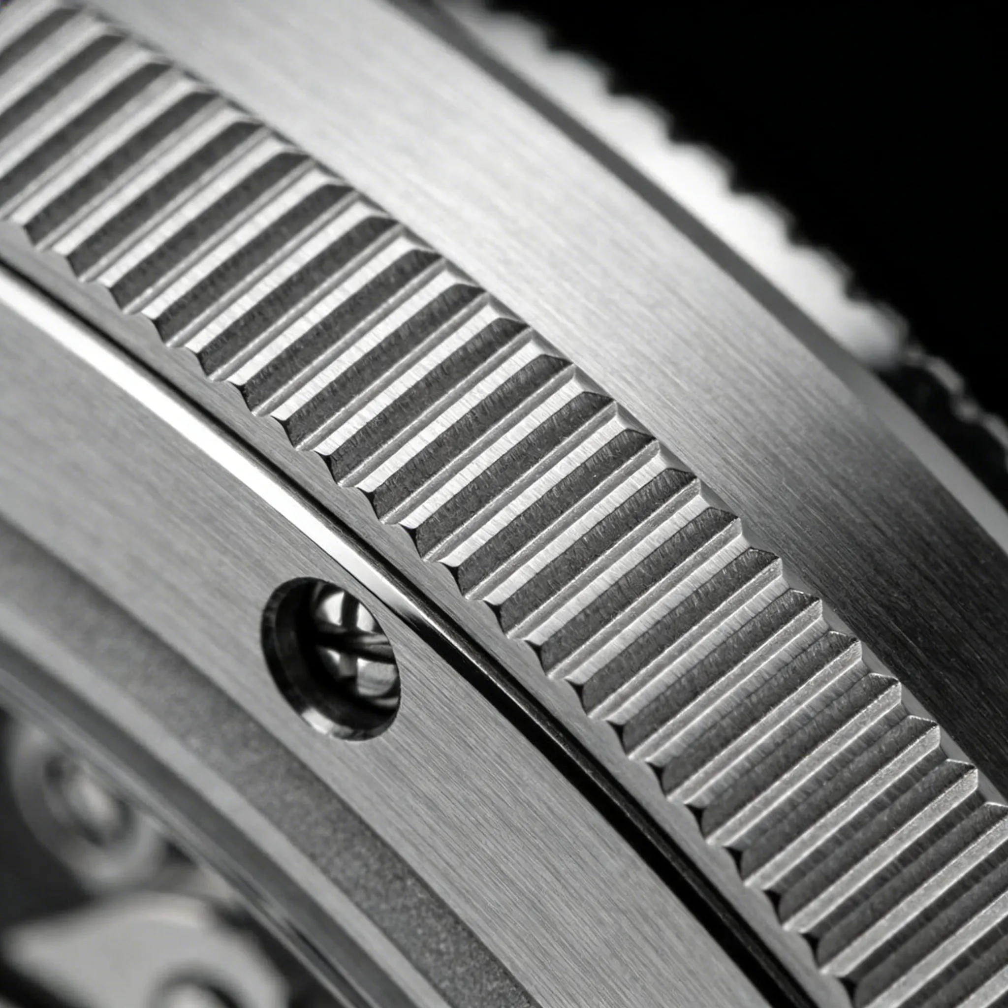 Macro detail showing brushing grain direction on a watch