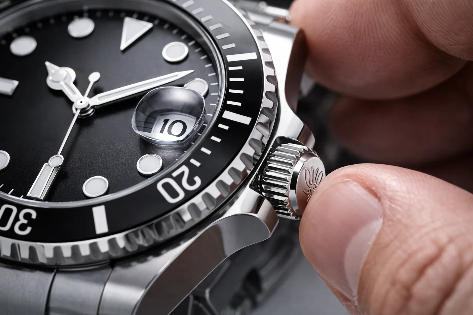 Close-up of a watch crown being adjusted, representing convenience of setting
