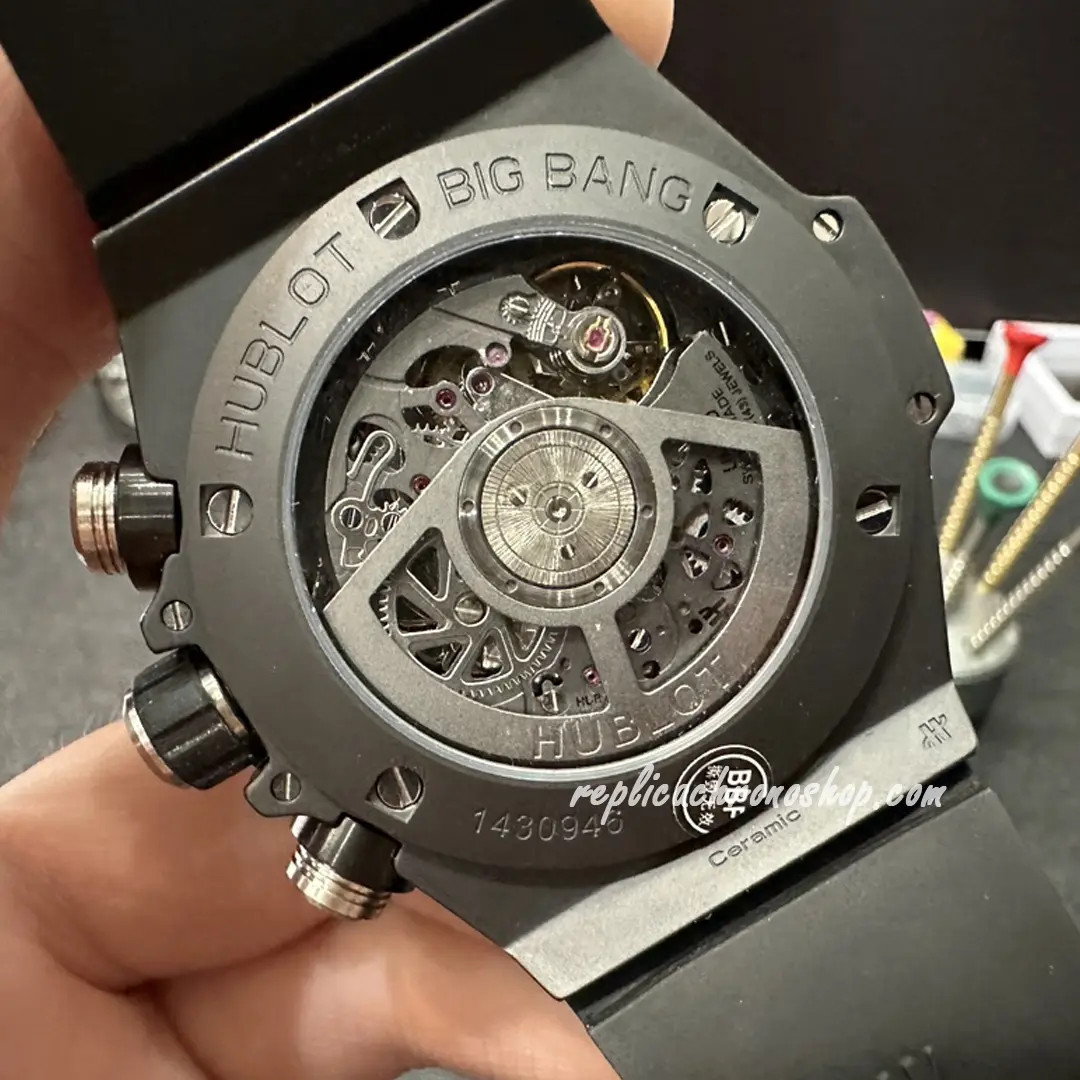 Back view showing exposed movement and rubber strap integration