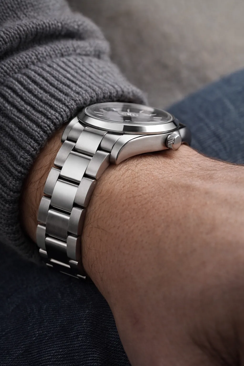Side view of a watch on wrist showing bracelet drape and natural fit