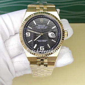 Replica Rolex Oyster Perpetual Date M127335-0001 – 40mm Black Honeycomb Dial, 14k Gold-Plated Stainless Steel Bracelet